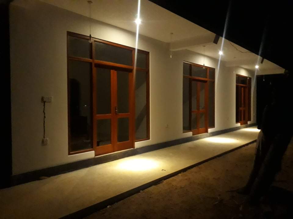 Villa veranda illuminated at night
